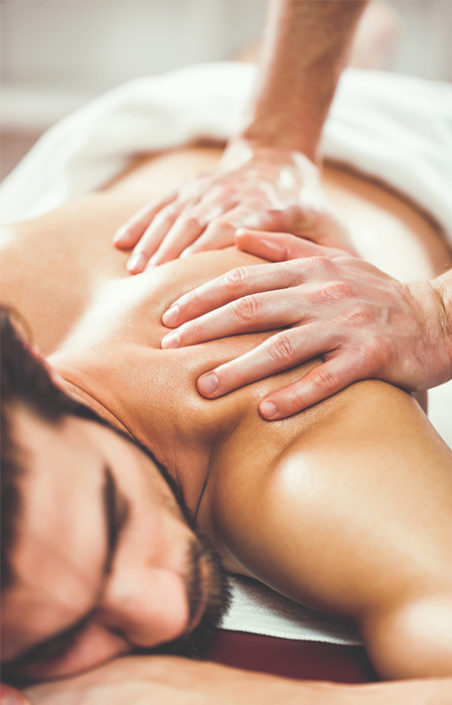 Man Receiving back massage benefits
